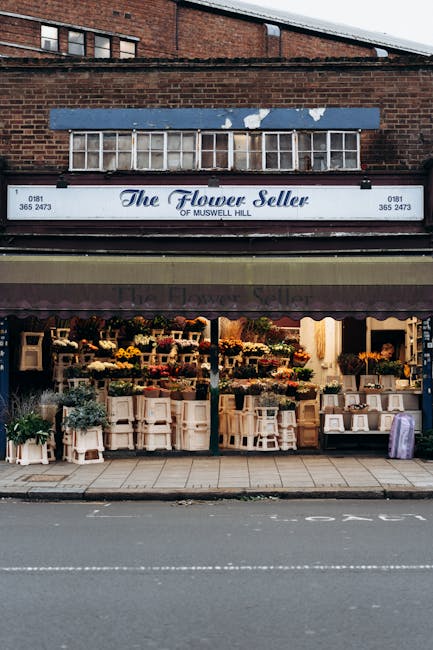 The Flower Seller of Muswell Hill storefront displaying a vibrant assortment of fresh flowers arranged in bouquets and floral arrangements. The display includes a wide variety of flowers such as roses