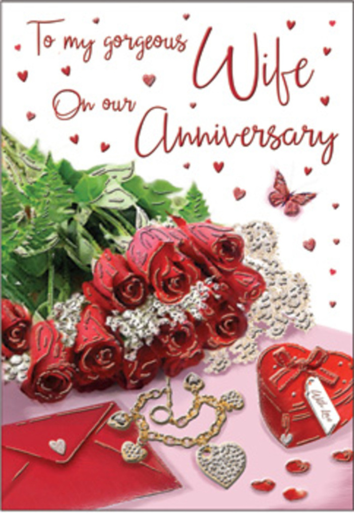 The image on this anniversary card unfolds like an elegant vignette set in Hampton Hill, carefully arranged with a florist's precision. At the centre, a cluster of classic red roses commands attention, each bloom full and luxuriant, their petals curling inwards in tight spirals that create a sense of depth and softness. The roses are framed by clean, glossy greenery that arcs gently around them, creating a natural cradle that enhances the rich crimson tones. To one side rests a neatly placed envelope, its pale, smooth surface offering a subtle contrast to the textured petals and shining leaves. A petite heart-shaped gift box, its contours softly rounded, sits near the bouquet, suggesting a treasured token or piece of jewellery waiting to be revealed after a cosy anniversary dinner near Hampton Hill High Street. A delicate piece of jewellery glints nearby-a fine chain or pendant perhaps-its metallic sheen catching the soft light that bathes the whole composition. Scattered around are tiny heart motifs, like little punctuation marks of affection, some perhaps slightly raised, others flat, giving the scene a sense of dimension. A single butterfly detail appears to hover above or beside the roses, evoking a gentle sense of movement and adding a touch of whimsy, the way butterflies might dance over gardens in nearby Bushy Park. The lighting is gentle and diffused, creating minimal shadows and lending the scene an inviting warmth that softens every edge. Together, these elements evoke the layered emotions of an anniversary-gratitude, passion, nostalgia-making this design feel like a heartfelt snapshot of love shared over many years in and around Hampton Hill.