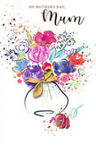 Joyful Mother's Day card design featuring a free-flowing watercolour bouquet, painted with the relaxed confidence of a seasoned Hampton Hill florist. At the heart of the scene, large, loosely defined blooms in magenta, cerise, and soft pink cluster together, their petals overlapping in splashes and swirls that hint at roses and other favourite garden flowers. Surrounding these bold shapes, indigo brushstrokes shape leaves and shadow, while lighter notes of blue, lavender, and apricot weave between the petals, softening the overall palette and creating a sense of depth and gentle movement. Fine golden lines and touches of metallic shimmer trace petal edges, arc along stems, and skim the top of the vase, reminiscent of the way evening light glints across the canopies in nearby Bushy Park. The background remains fresh and white, allowing clusters of tiny hearts, splatters, and softly scattered dots to float freely around the bouquet, like petals tossed in the air to mark a special moment. The vase itself is rendered with graceful, minimal strokes, more suggestion than detailed drawing, yet its golden bow is carefully painted, bringing to mind the final ribbon-tie before a bouquet leaves the Hampton Hill shop for same-day delivery. Altogether, the illustration feels airy and heartfelt, balancing vibrant colour with emotional warmth. It communicates love, appreciation, and the joy of giving flowers to a cherished mum, making the card feel like a keepsake she would want to keep long after Mother's Day has passed.